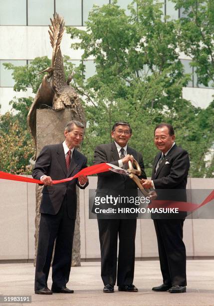 Secretary of Transportation Norman Mineta cuts the ribbon during the opening ceremony of the National Japanese American Memorial to Patriotism 29...
