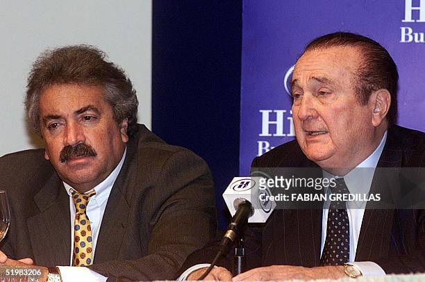 The President of the Colombian Soccer Federation, Alvaro Fina listens, at a hotel in Buenos Aires, 30 June 2001, to the president of the South...