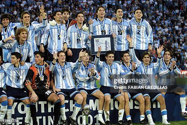 Argentine players celebrate their victory over Ghana in the final of the World Cup Sub-20 Championships 08 July 2001 in Buenos Aires. Argentina was...