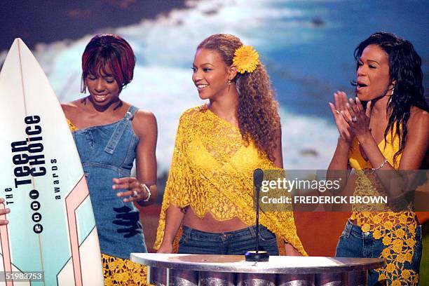 Members of the group Destiny's Child accept their award for Choice Pop Group during the taping of the Teen Choice 2001 Awards at the Universal...