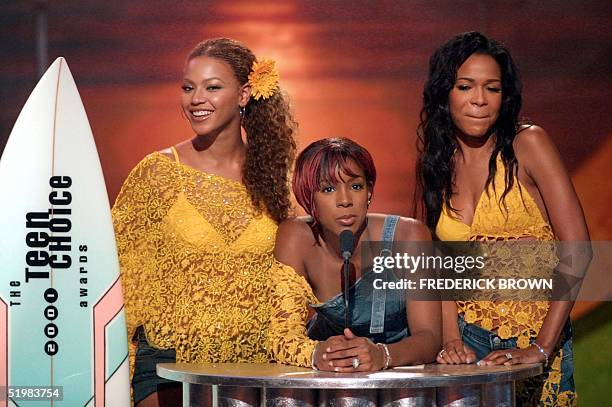 Members of the group Destiny's Child accept their award for Choice Pop Group during the taping of the Teen Choice 2001 Awards at the Universal...