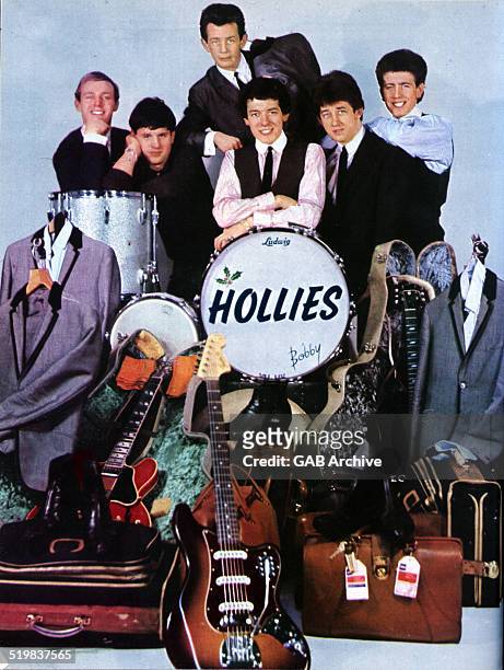 Group portrait of The Hollies with their road manager , 1964. L-R Bobby Elliott, Eric Haydock, Allan Clarke, Tony Hicks, Graham Nash.
