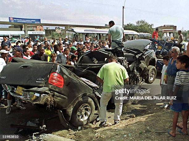 Group of people in Cali, Colombia watch the scene of the 19 August accident which involved Colombian soccer player Jairo "Tigre" Castillo who was...