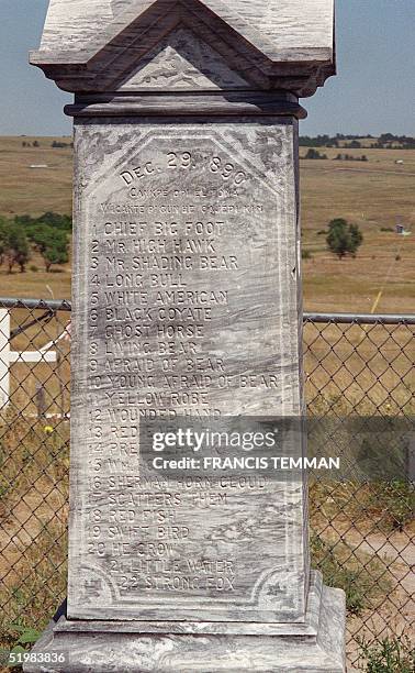 This August, 2001 photo shows a monument at the burial site of Lakota Native Americans killed in the 29 December 1890 massacre by US Army soldiers at...