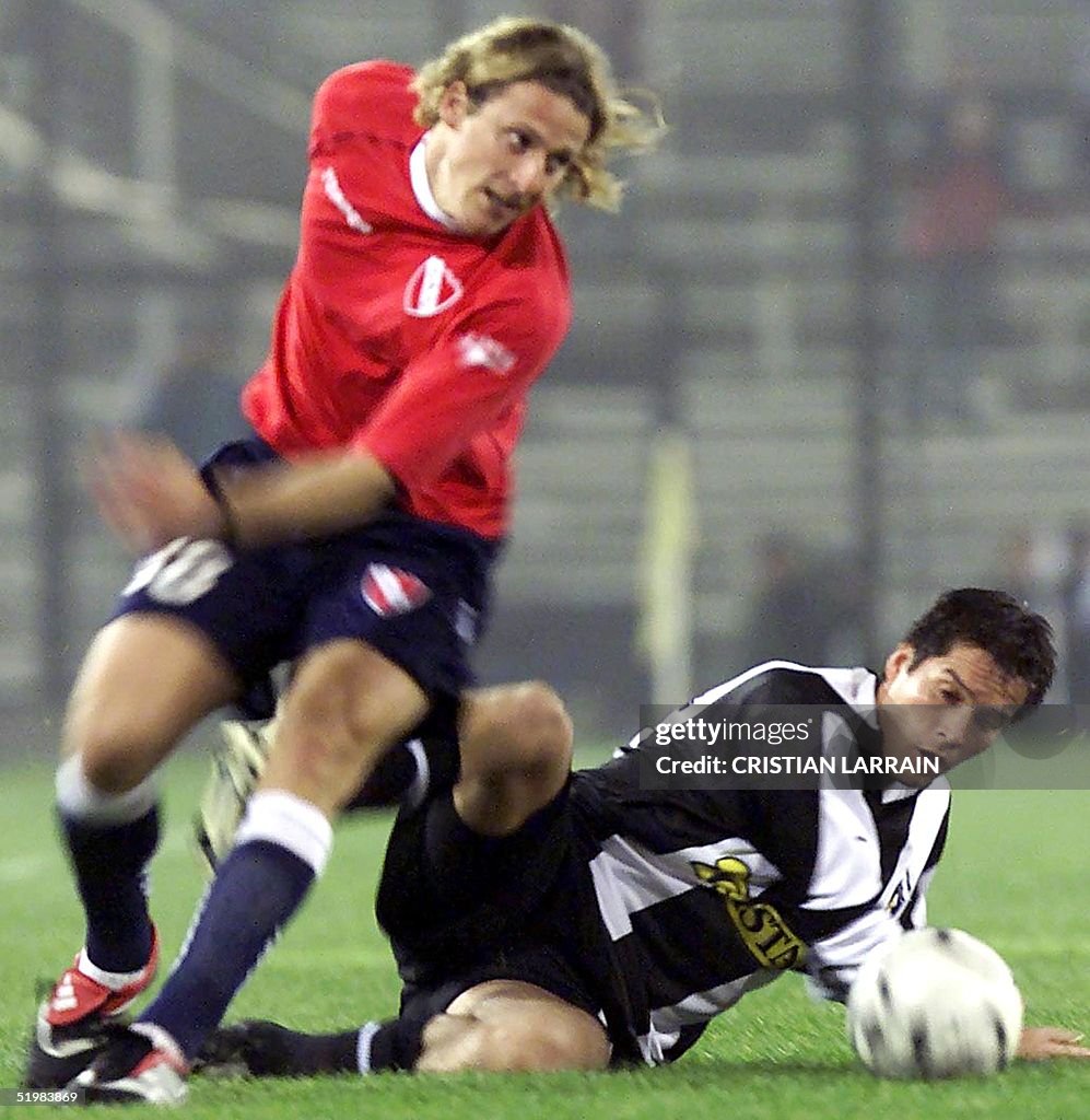 Diego Forlan Ripped Diego Forlan of Argentina's Independiente fights for the ball with ...