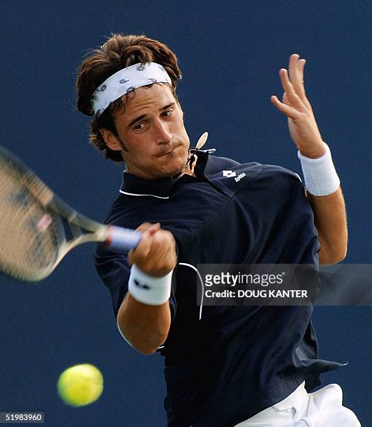 Galo Blanco of Spain returns the volley to 12th-seed Arnaud Clement of France during their first round match at the US Open 29 August 2001 at...
