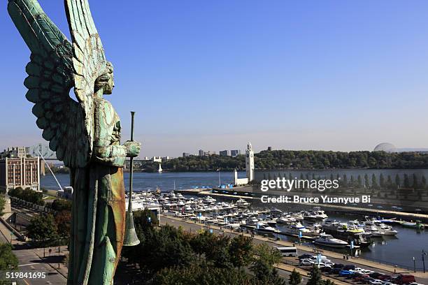 angel statue with old port - montreal clock tower stock pictures, royalty-free photos & images