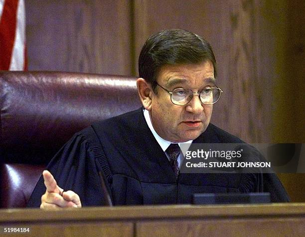Judge Guy Burningham listens to motions to allow Tom Green who was convicted of bigamy and criminal nonsupport to be released from prison to help his...