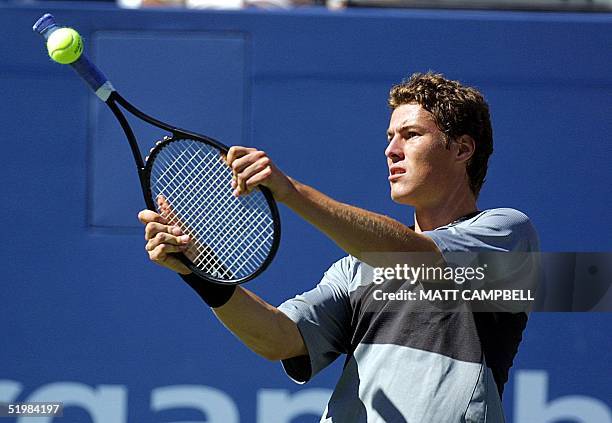 Third seeded Marat Safin of Russia hits an out-of-play ball with his racquet handle during his match with unseeded Mariano Zabaleta of Argentina at...