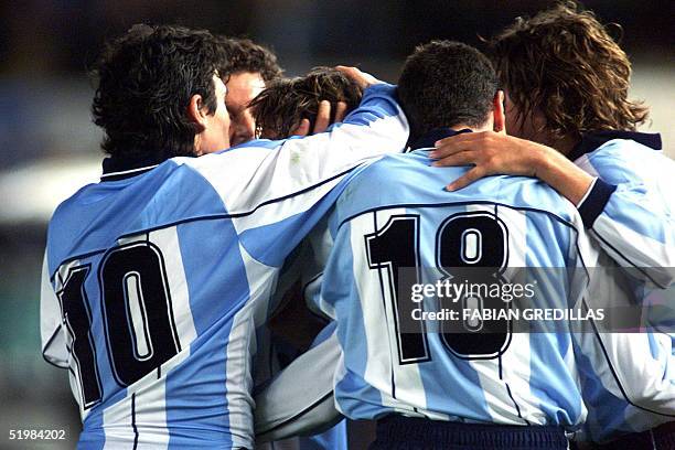 Argentinian soccer players celebrate their second goal against Brazil in the Monumental stadium in Buenos Aires 5 September 2001. Argentina won 2-1...