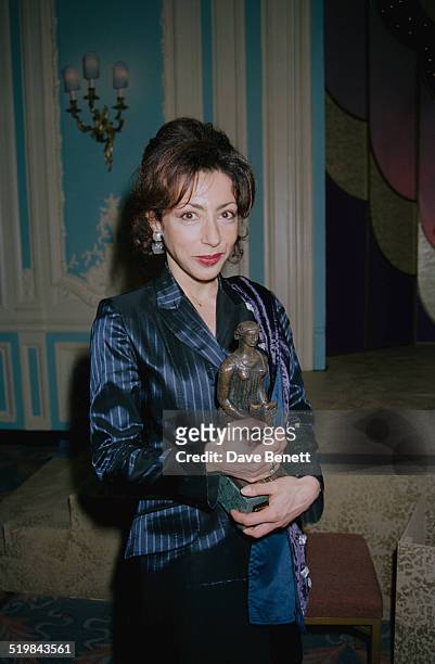 French writer Yasmina Reza with her Best Comedy award for 'Art' at the Evening Standard Theatre Awards, held at the Savoy Hotel, London, 29th...