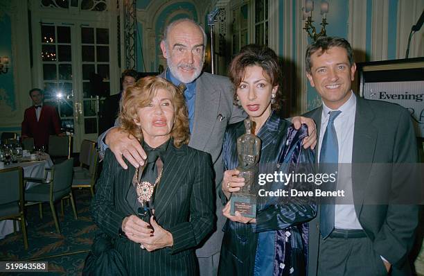 Scottish actor Sean Connery with his wife, Micheline Roquebrune and French writer Yasmina Reza, at the Evening Standard Theatre Awards, held at the...