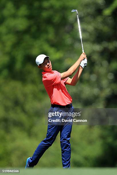 Amateur Cheng Jin of China plays his second shot on the fifth hole during the second round of the 2016 Masters Tournament at Augusta National Golf...