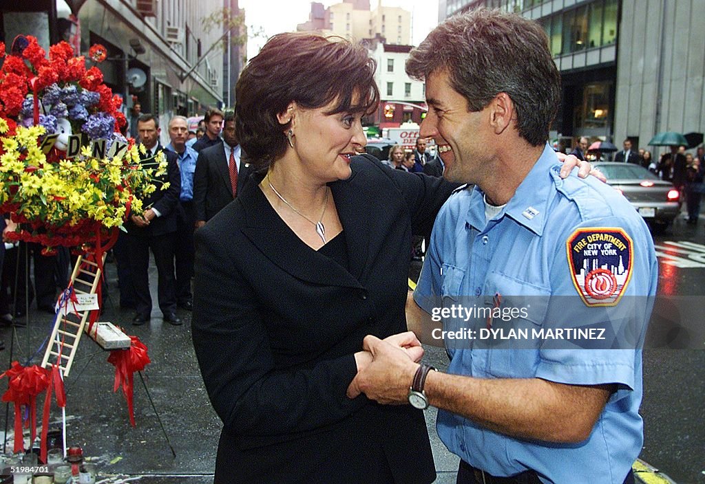 Cherie Blair , wife of British Prime Minister Tony Blair, embraces 20