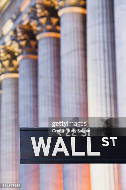 wall street sign and new york stock exchange - wall street lower manhattan stock pictures, royalty-free photos & images