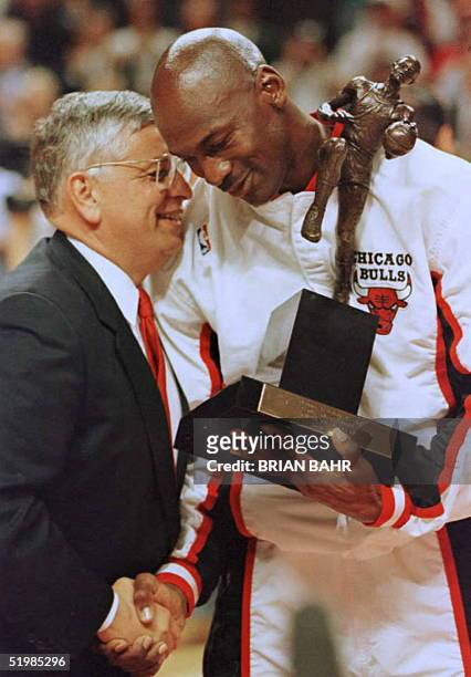 National Basketball Association Commisioner David Stern congratulates Chicago Bulls guard Michael Jordan during the 1996 NBA Most Valuable Player...