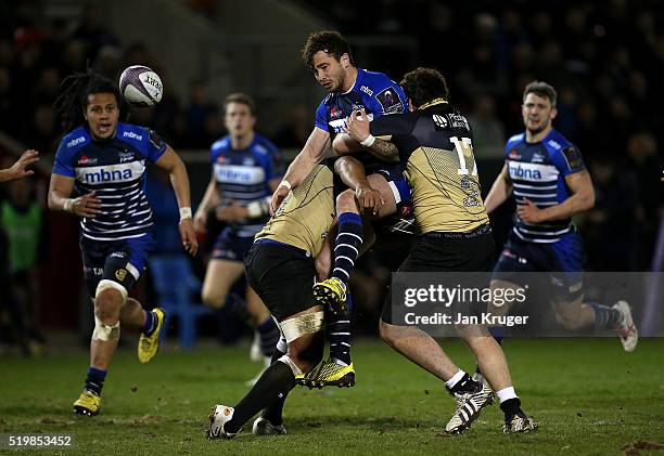 Danny Cipriani of Sale Sharks is upended by Yvan Watremez and Akapusi Qera of Montpellier during the European Rugby Challenge Cup Quarter Final match...