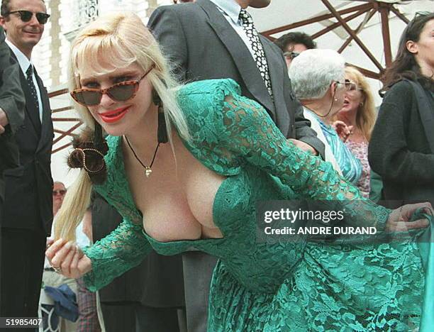La Cicciolina, former Italian porno-star and former member of Italian Parliament, poses for photographers 15 May on the steps of one of the hotels on...
