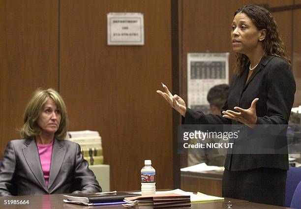 Sara Jane Olson listens as her defense attorney Shawn Snyder Chapman argues a point 15 October 2001 in Los Angeles court before the judge rejected a...
