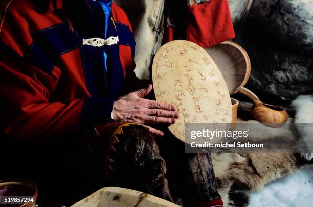 saami shaman holding ceremonial drum - sami stock pictures, royalty-free photos & images