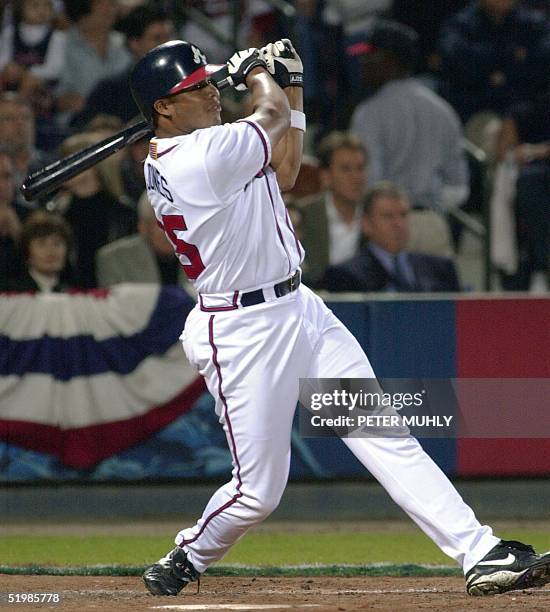 Andruw Jones of the Atlanta Braves watches his solo home run in the second inning against the Arizona Diamondbacks in game four of the National...