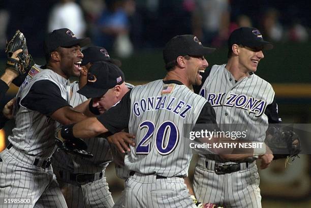 Reggie Sanders , Matt Williams , Luis Gonzalez and series MVP Criag Counsell of the Arizona Diamondbacks celebrate after winning the National League...