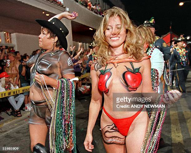 Body-painted revelers march down Duval Street in Key West, Florida late 27 October 2001, during the Fantasy Fest Parade, a highlight event of the...