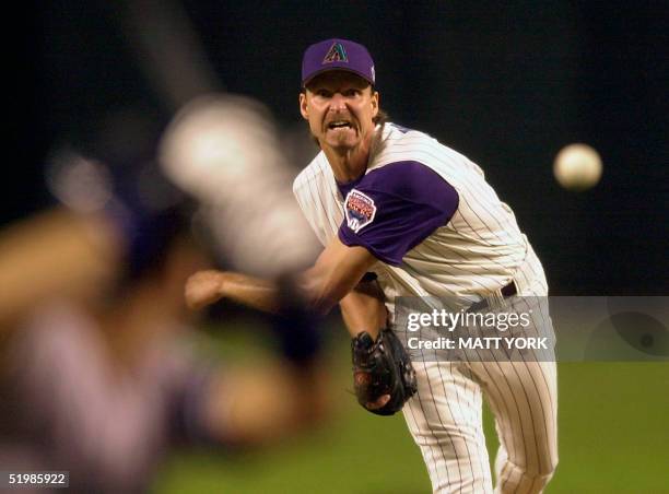 Arizona Diamondbacks' pitcher Randy Johnson watches his delivery to a New York Yankees batter during the 1st inning of Game 2 of the 2001 World...