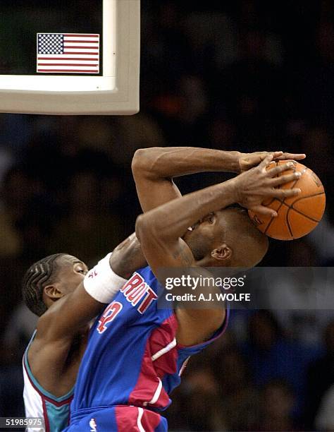 Memphis Grizzlies Lorenzen Wright fouls Detroit Piston's Jerry Stackhouse during the fourth quarter of the Piston's 90-80 win over the Grizzlies 01...