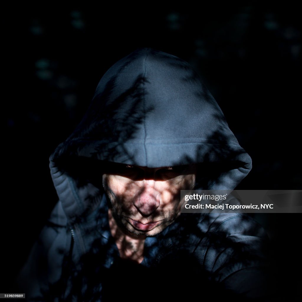 Portrait of  man in a hood.