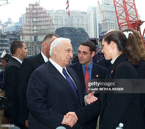 Israeli Prime Minister Ariel Sharon shares a moment with Sigal Shefi an Israeli citizen who lost her husband in the World Trade Center terrorist...