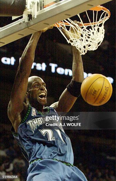 Minnesota Timberwolves' Kevin Garnett slams the ball in the first quarter against the Memphis Grizzlies 06 December 2001 at The Pyramid in Memphis,...