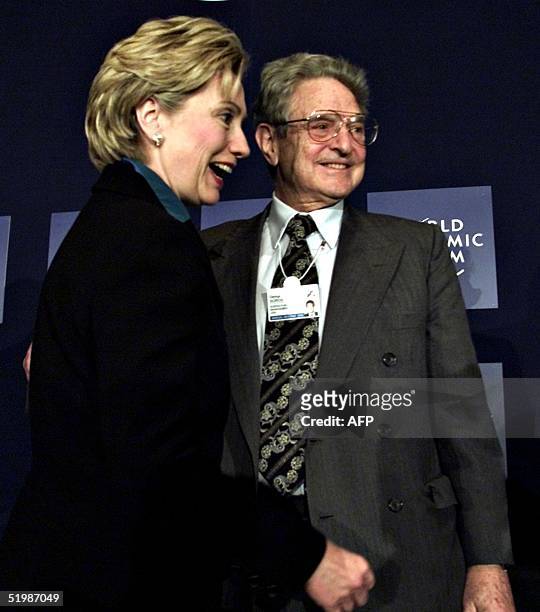 New York Senator Hilary Rodman Clinton greets worldwide investor and philanthropist George Soros at the World Economic Forum in New york 03 Febuary...