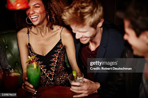 friends having drinks and hanging out at a bar. - woman after party - fotografias e filmes do acervo