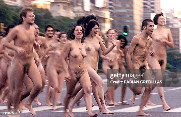 Group of naked people are seen running to pose for photographer Spencer Tunick, in central Buenos Aires, 06 April 2002. New York photographer Spencer...