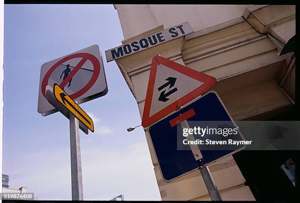 signs along mosque street - name spelling singapore stock pictures, royalty-free photos & images