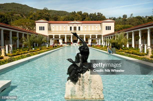 Sculpture in the central pool in the courtyard of the newly restored Getty Villa Art Museum, in Malibu, California. The Villa was modeled on an...