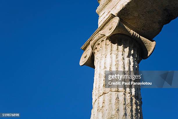 ionic column of the philippeion in ancient olympia - ionic foto e immagini stock