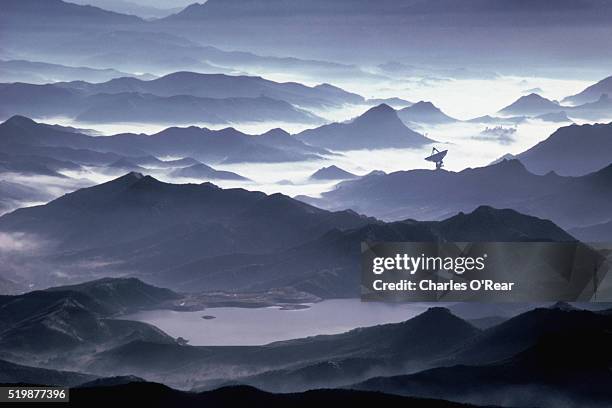 satellite dish on foggy mountains - satellite dish bildbanksfoton och bilder