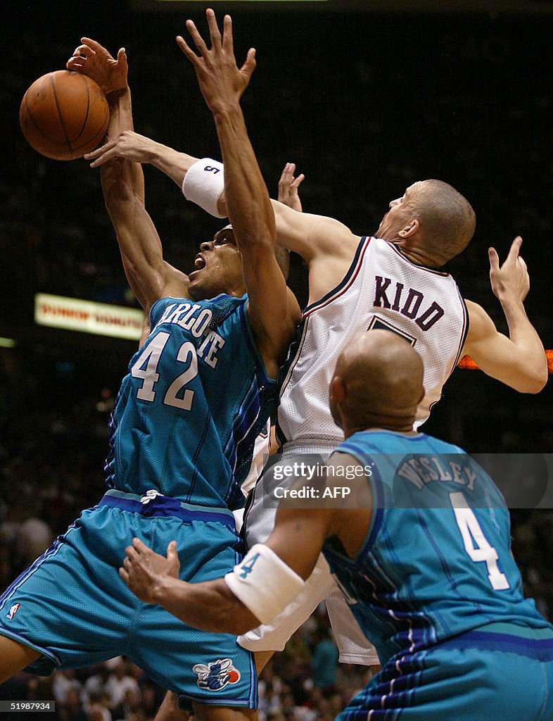 P.J. Brown (L) of the Charlotte Hornets has the ba