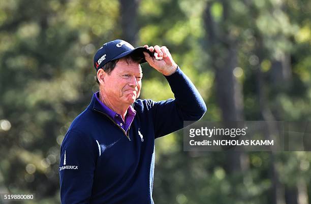 Golfer Tom Watson reacts as he arrives on the 18th green during Round 2 of the 80th Masters Golf Tournament at the Augusta National Golf Club on...