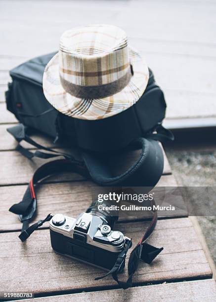 camera, bagpack and hat - bagpack stock pictures, royalty-free photos & images