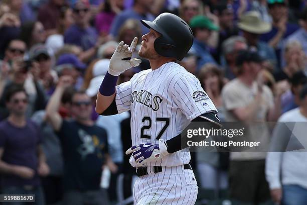 Trevor Story of the Colorado Rockies celebrates his two run home run off of Colin Rea of the San Diego Padres as the Padres held a 6-5 lead in the...