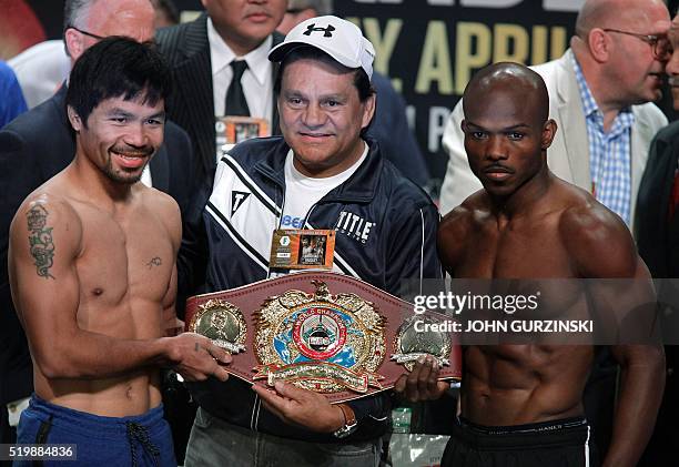 Boxers Manny Pacquiao and Timothy Bradley Jr. Pose with Roberto Duran holding the WBO International Championship belt during their weigh-in on April...