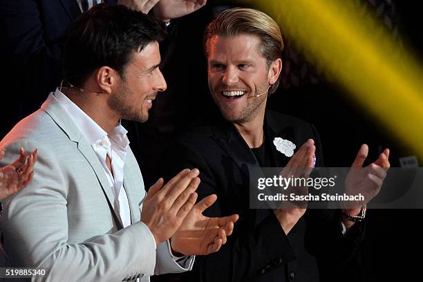 Bachelor" participants Leonard Freier and Paul Janke react during the 4th show of the television competition 'Let's Dance' at Coloneum on April 8,...