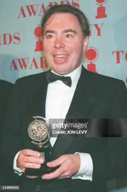 Sir Andrew Lloyd Webber poses for photographers after receiving the Tony Award for Best Musical 04 June in New York. Webber won for his production of...
