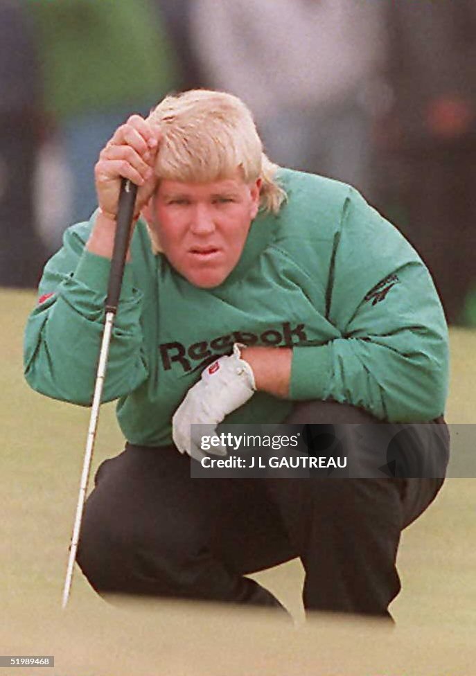 John Daly of the US lines up a putt at the 17th ho