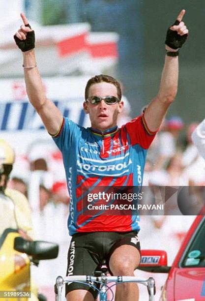 Cyclist Lance Armstrong raises his arms in victory as he wins the 18th stage of the Tour de France 21 July. Armstrong dedicated his victory to late...