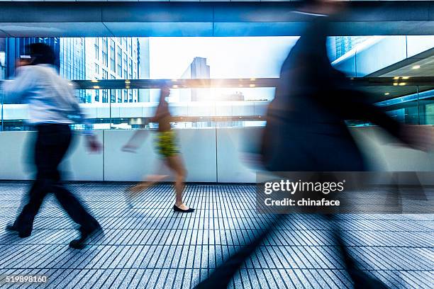 rush hour passengers at walkway - motion business speed stock pictures, royalty-free photos & images