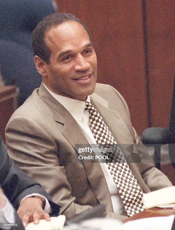 Double-murder defendant O.J. Simpson smiles as his